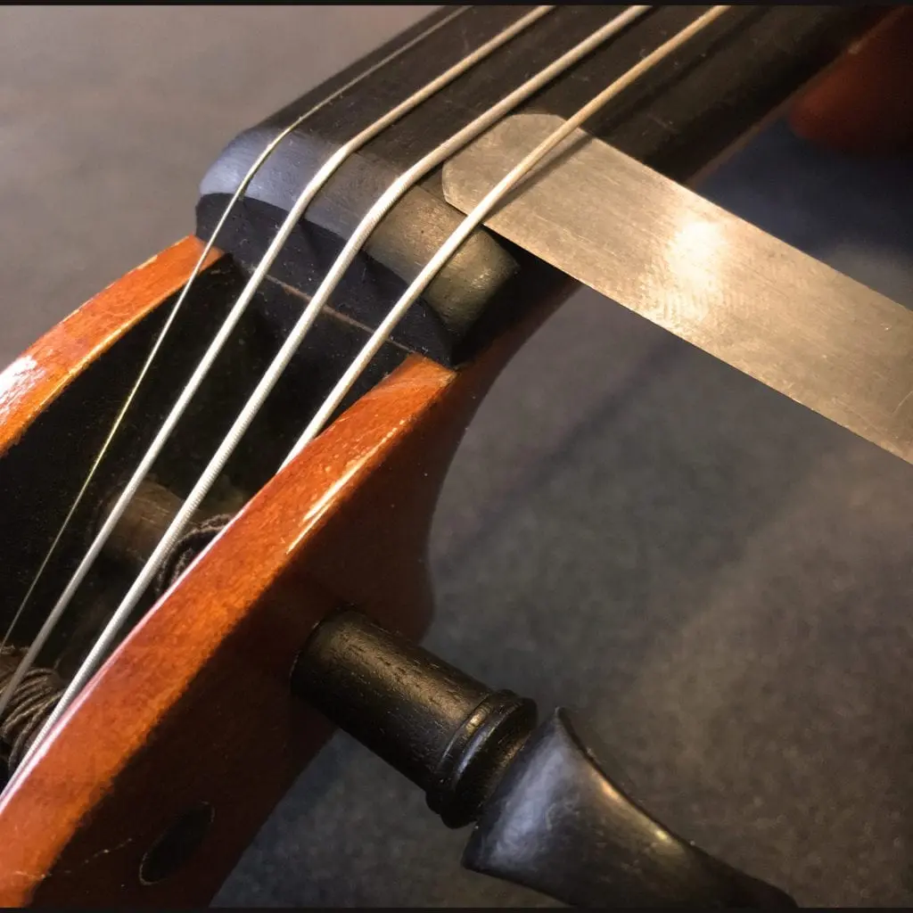 violin string height - How far off the fingerboard should violin strings be